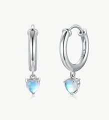 Sterling silver heart hoop earrings with a polished finish and a delicate heart-shaped drop.