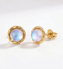 Very small moonstone stud earrings set in 14K gold plated stainless steel with a soft iridescent finish.