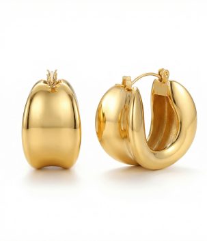 Gold dome hoop earrings with a smooth rounded design and polished gold finish.