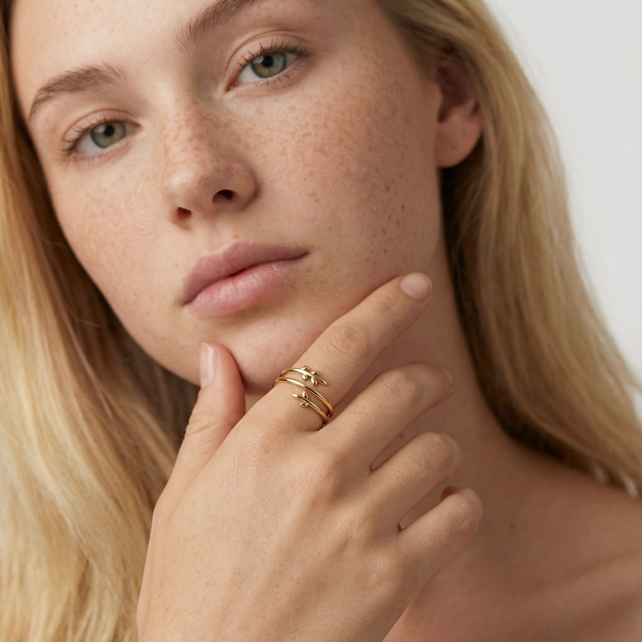 Gold plated adjustable ring worn on hand, hypoallergenic minimalist leaf design