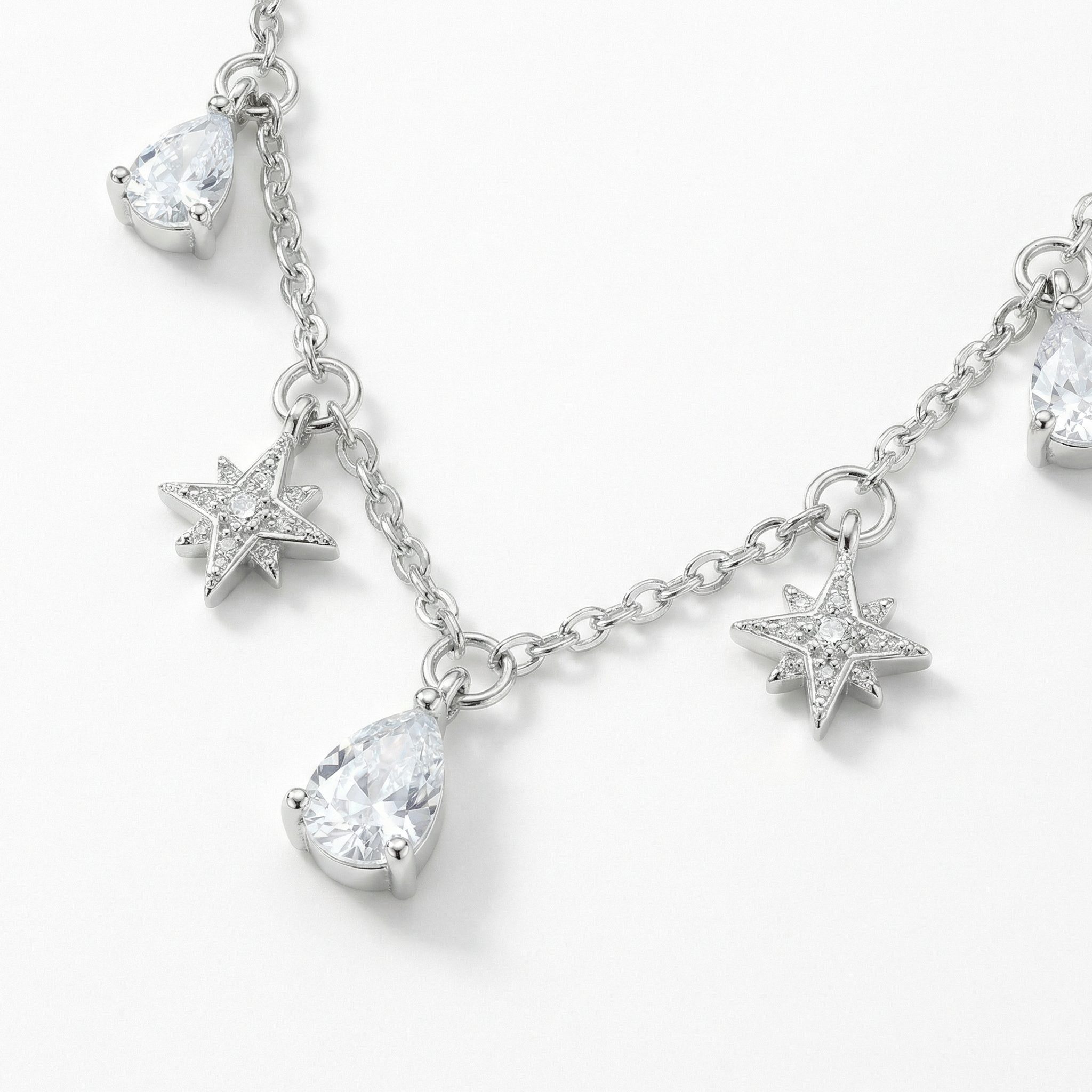 Sterling silver zircon necklace with star and teardrop charms, lightweight 1.8g women’s jewellery on white background