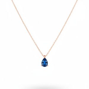 Rose gold plated teardrop gemstone necklace with blue crystal pendant on fine chain